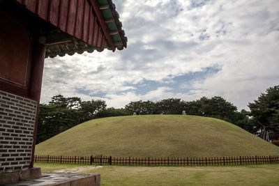 Built structure against cloudy sky