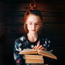 Young woman reading book