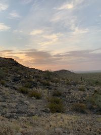 Scenic view of field against sky during sunset