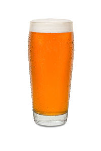 Close-up of beer glass against white background