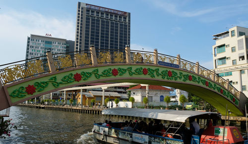 Arch bridge over river in city