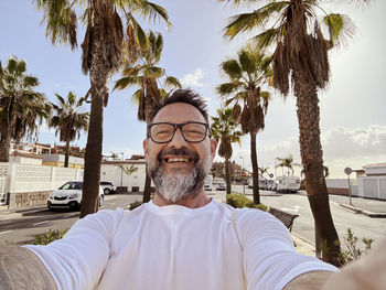 Portrait of man sitting at beach