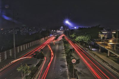 High angle view of light trails on road at night