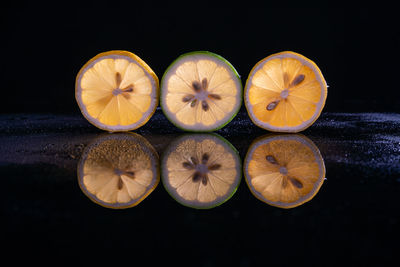 High angle view of oranges on table against black background