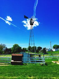 Wind turbines on grassy field