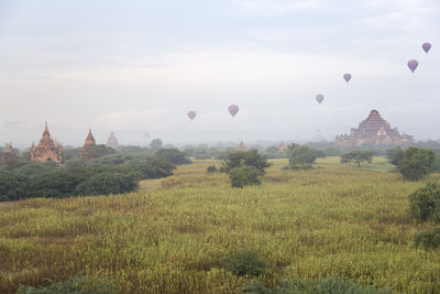 Hot-air balloons flying over dhammayangyi temple (bagan)