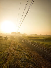 Scenic view of field against sky during sunset