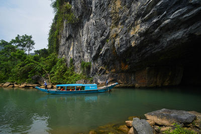 Scenic view of rock formation by sea against sky