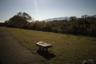 Lifeguard hut on field against sky