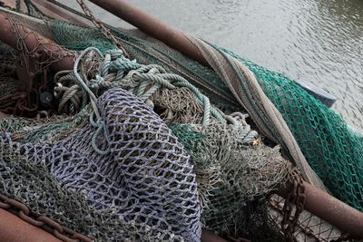 High angle view of fishing net in boat on sea