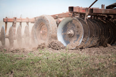 Agriculture machine on field against sky