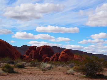 Rock formations on landscape against sky