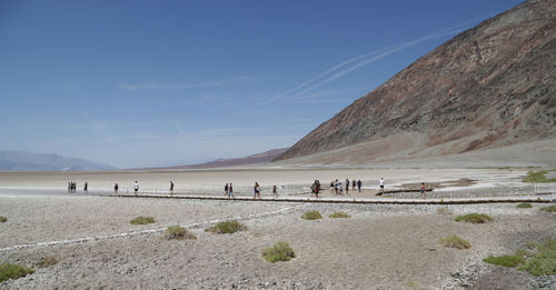 People at yellowstone national park against sky