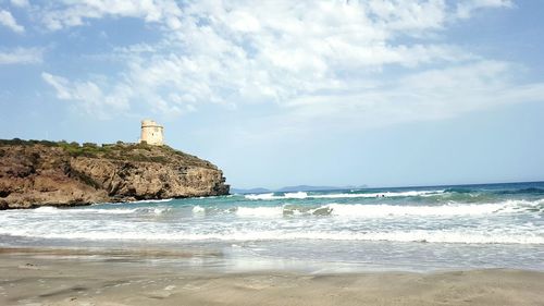 Scenic view of sea against cloudy sky