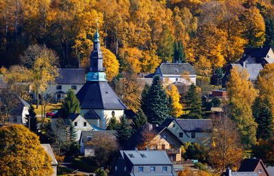High angle view of trees and buildings during autumn
