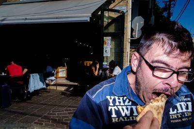 Portrait of man eating food