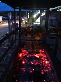 High angle view of illuminated barbecue grill