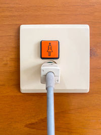 Close-up of information sign on wall