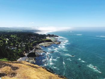 High angle view of sea against blue sky