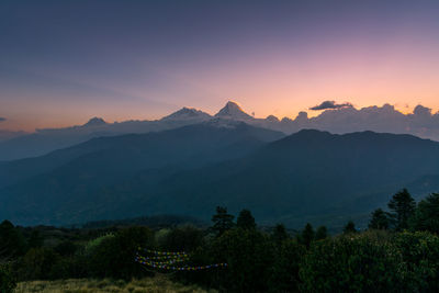 Scenic view of mountains against sky during sunset