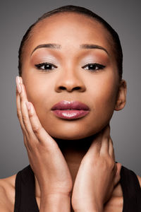 Portrait of beautiful young woman over white background