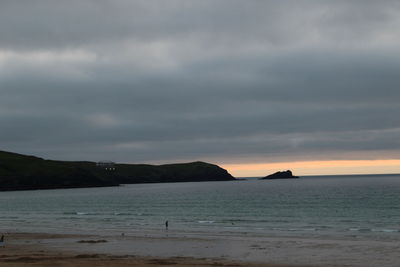 Scenic view of beach at sunset