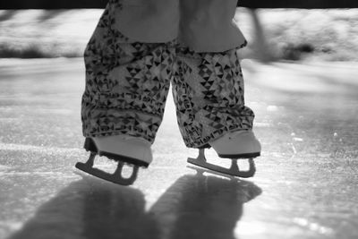 Low section of woman standing on ground