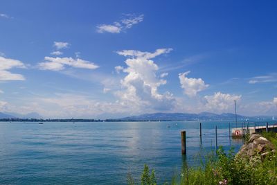 Scenic view of sea against blue sky