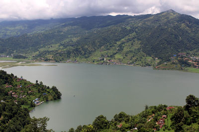 Scenic view of lake and mountains against sky