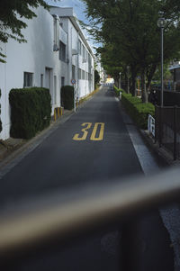 Road by buildings in city