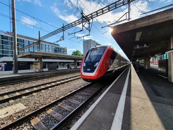 Train on railroad station platform against sky