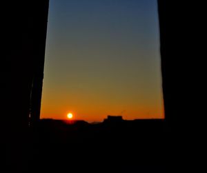 Scenic view of silhouette landscape against clear sky during sunset