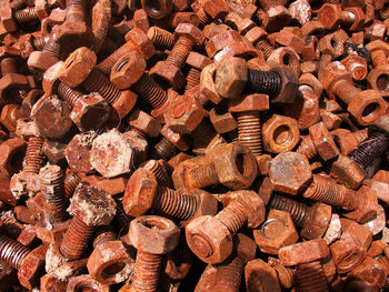 Full frame shot of rusty metallic nuts and bolts