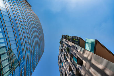 Low angle view of modern buildings against sky