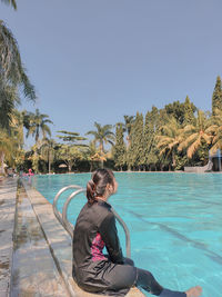 Girl wearing a swimsuit by the pool, taken on june 22, 2020, lampung, indonesia