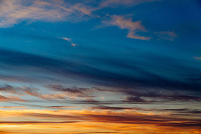 Low angle view of dramatic sky during sunset