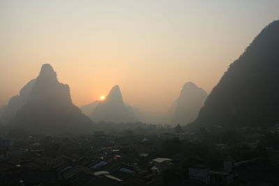 Scenic view of mountains at sunset