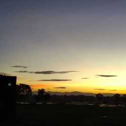 Scenic view of silhouette landscape against romantic sky at sunset