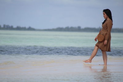 Woman standing at beach