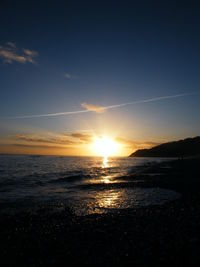 Scenic view of sea against sky at sunset