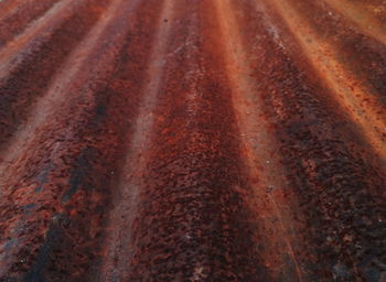 Full frame shot of rusty metal on field