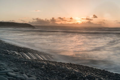 Scenic view of sea against sky during sunset