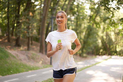 Full length of a smiling young woman