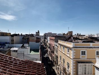 High angle view of buildings in city against sky