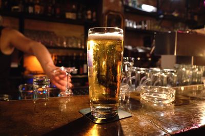 Close-up of beer glass on table