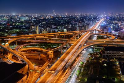 High angle view of illuminated cityscape at night