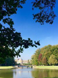 Calm river with buildings in background