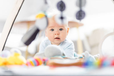 Portrait of cute girl playing with toys