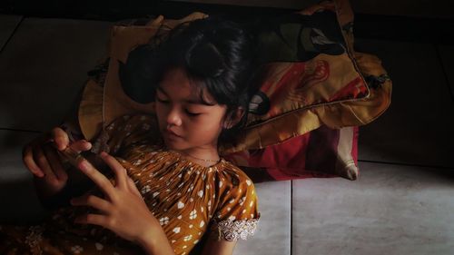 Little girl with cellphone in leisure time