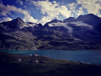 Scenic view of mountains and lake against sky